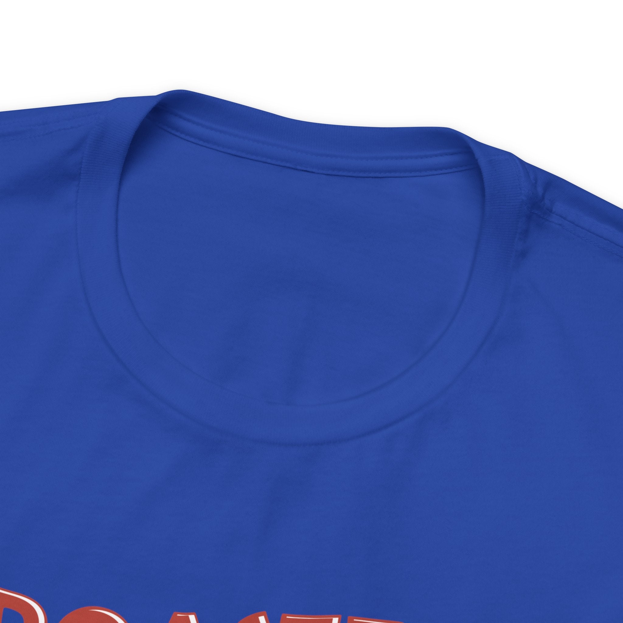 Detailed close-up of a royal blue Seattle coffee graphic T-shirt featuring the top section of the “Roasted 818 Miles East of Seattle” design.