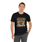 Male model wearing a black Rock Creek Coffee T-shirt featuring the “Around the Corner From Ordinary” graphic print