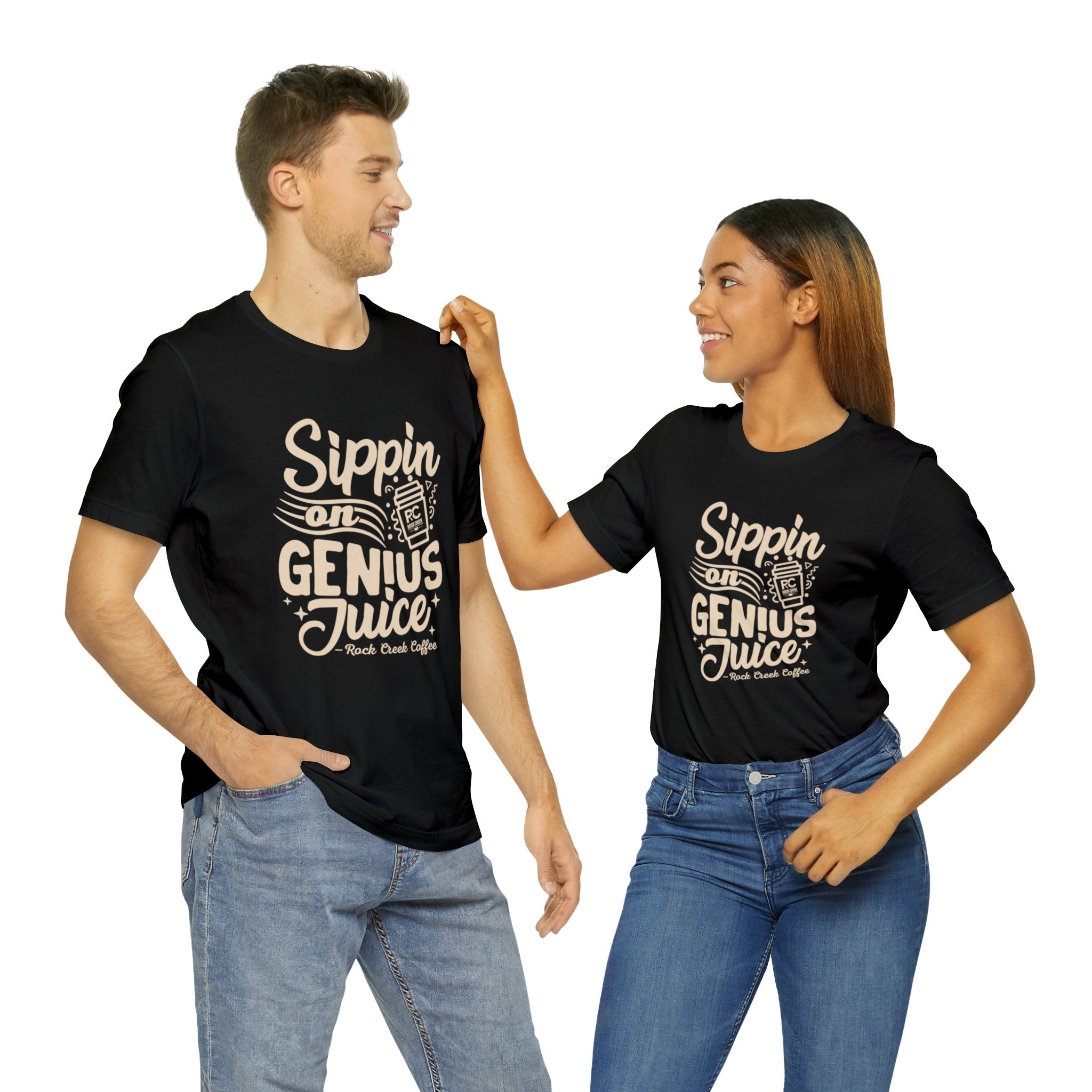 Smiling man and woman standing side by side, both wearing black short-sleeve T-shirts printed with the slogan “Sippin on Genius Juice” and a stylized coffee to-go cup graphic, shown against a plain white background.