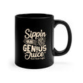 Black ceramic coffee mug with “Sippin on Genius Juice Rock Creek Coffee” design in light lettering, filled with hot coffee and steam rising, displayed on a cozy tabletop with pinecones, a lit candle, cinnamon sticks, an orange, and soft string lights in the background.