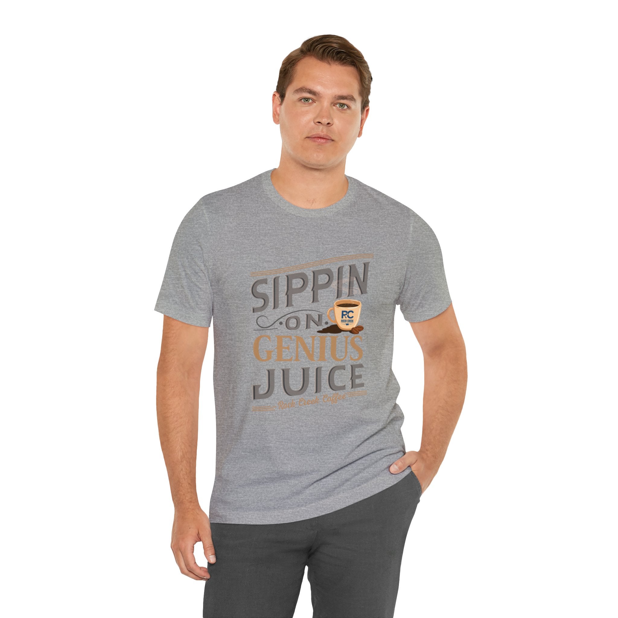 Adult man wearing a heather gray short-sleeve T-shirt featuring the “Sippin on Genius Juice” graphic in bold stacked lettering with a small coffee cup icon, posed against a plain white background.