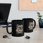 Two black Rock Creek Coffee mugs with “Sippin on Genius Juice” design in cream lettering displayed on a desk with a laptop, binder clips, stacked books, and a small potted plant in the background.