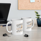 Two white Rock Creek Coffee mugs featuring the phrase “Sippin on Genius Juice” in stylized gray and gold lettering, displayed on a desk with a laptop, binder clips, books, and a small potted plant visible in the background.
