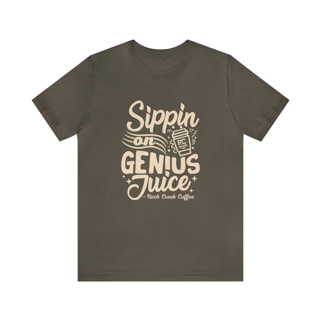 Olive green short-sleeve T-shirt displayed flat against a white background featuring a bold coffee-themed graphic that reads “Sippin on Genius Juice” with a stylized coffee to-go cup illustration.