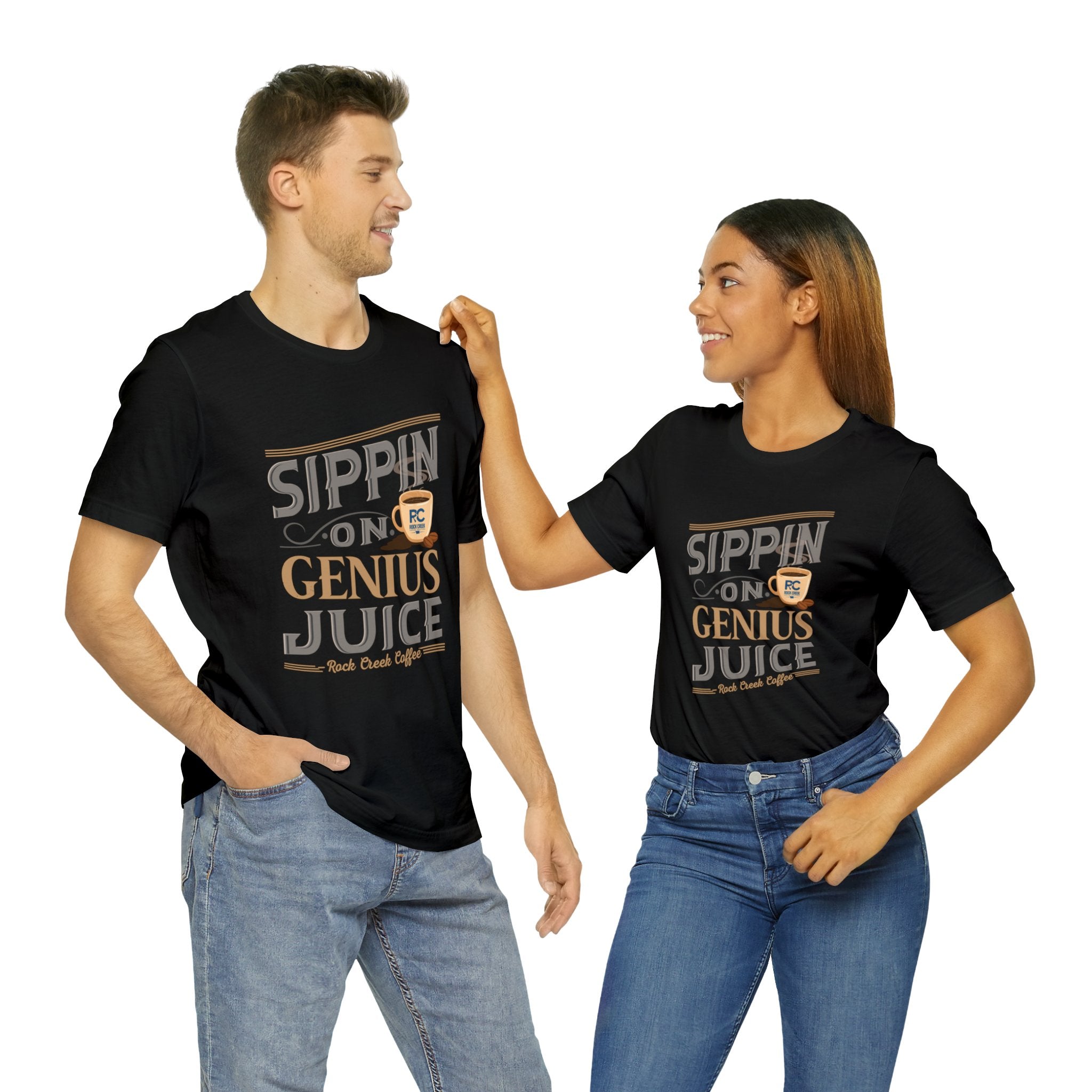 Adult man and woman modeling matching black short-sleeve T-shirts featuring the “Sippin on Genius Juice” graphic in bold coffee-inspired lettering with a small cup illustration, posed together against a plain white background.