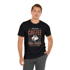 Adult man posing with one hand in his pocket while wearing a black short-sleeve T-shirt printed with the “Fueled by Coffee and Dad Jokes” graphic, featuring a coffee cup illustration and Rock Creek Coffee text, shown against a plain white background.