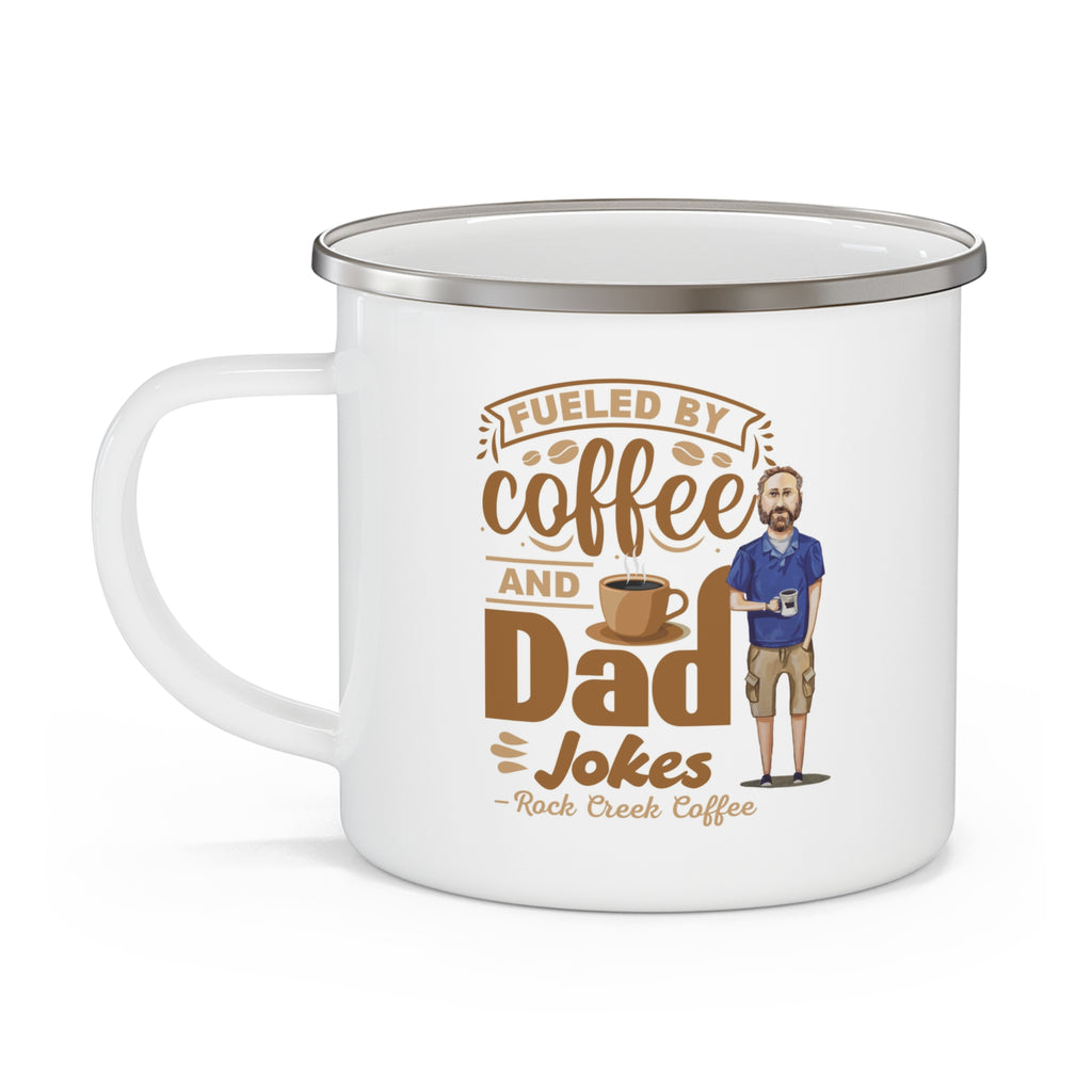 White enamel-style coffee mug with silver rim and handle featuring the phrase “Fueled by Coffee and Dad Jokes - Rock Creek Coffee” in brown lettering, with a coffee cup graphic and an illustration of a bearded dad holding a mug.