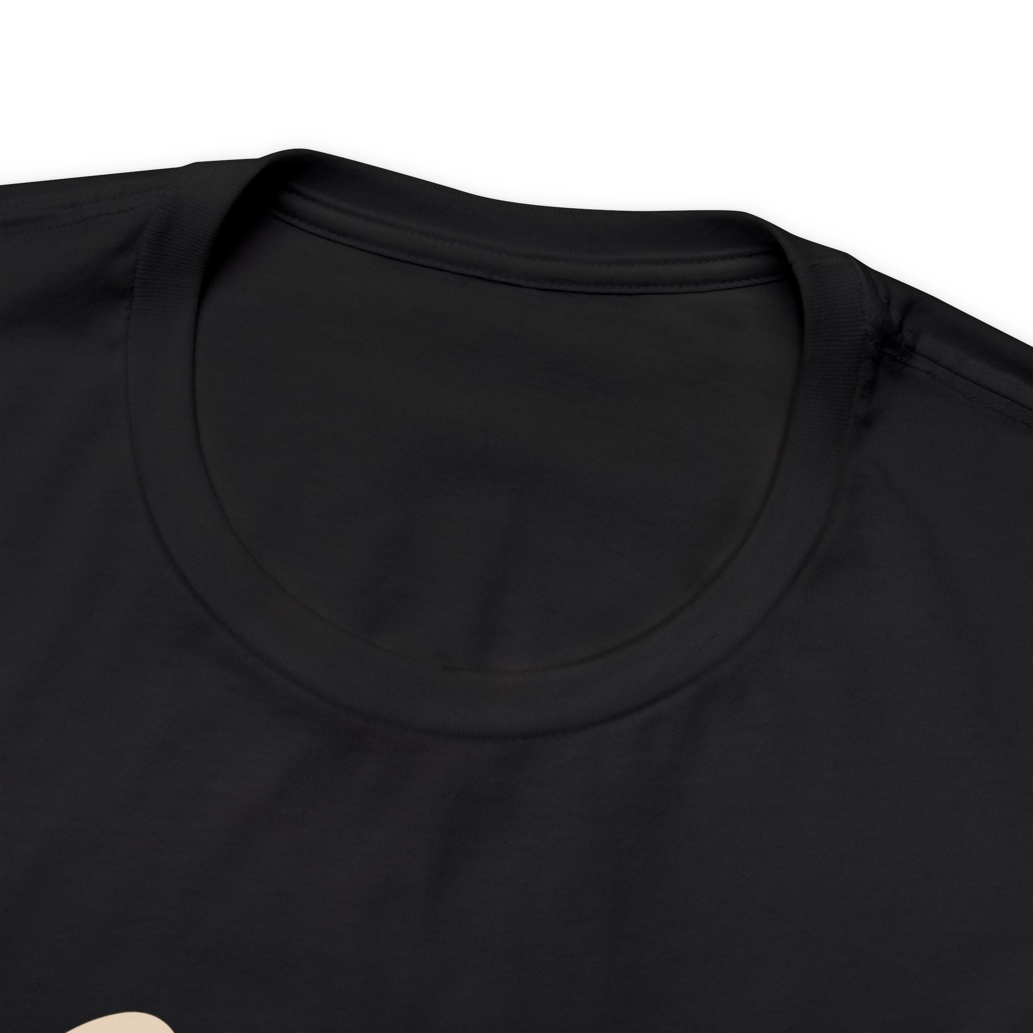 Detail view showing the crew neckline and shoulder area of a black short-sleeve T-shirt on a white background, focusing on fabric texture, collar stitching, and smooth knit.