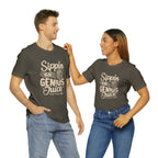 Smiling man and woman standing side by side, both wearing olive green short-sleeve T-shirts printed with the slogan “Sippin on Genius Juice” and stylized coffee to-go cup graphics on the front, against a plain white background.