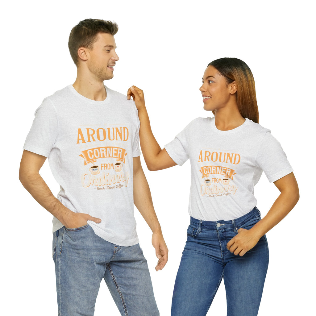 Two models wearing matching ash Rock Creek Coffee T-shirts featuring the “Around the Corner From Ordinary” graphic design