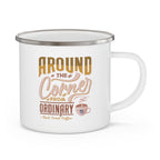 White enamel style coffee mug with silver rim and handle featuring the phrase Around the Corner from Ordinary Rock Creek Coffee in tan and brown lettering with a small coffee cup illustration.