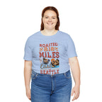 Adult woman modeling a light blue short-sleeve Seattle coffee graphic T-shirt reading “Roasted 818 Miles East of Seattle,” shown against a plain white background.