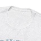 Close-up detail of an ash crew neck T-shirt showing the neckline and upper chest area, with the top edge of the “Fueled by Coffee and Dad Jokes” graphic partially visible against a plain white background.