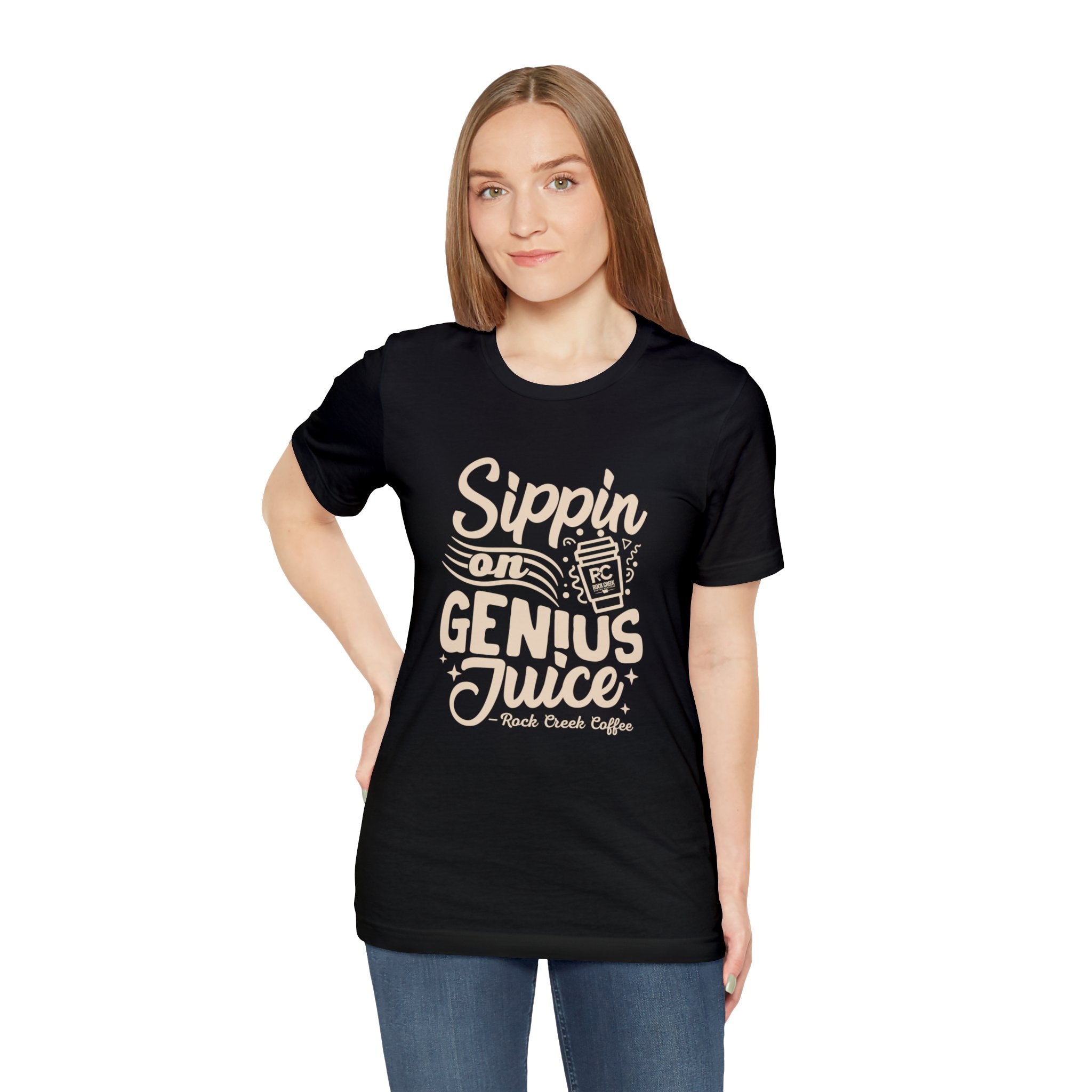 Adult woman modeling a black short-sleeve T-shirt printed with the slogan “Sippin on Genius Juice” and a stylized coffee to-go cup graphic on the front, shown against a plain white background.