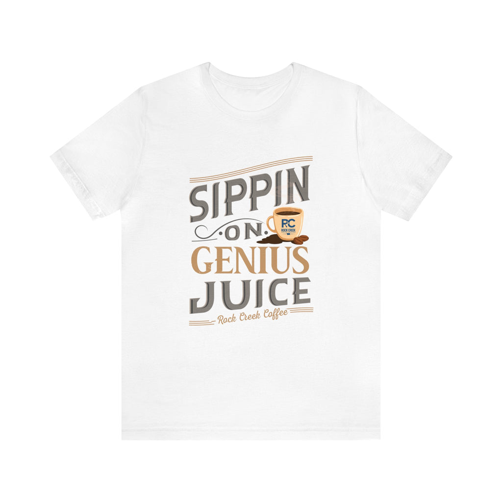 White short-sleeve T-shirt displayed flat against a plain white background, featuring the “Sippin on Genius Juice” graphic in bold coffee-inspired lettering with a small mug illustration.