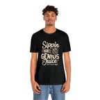 Adult man modeling a black short-sleeve T-shirt printed with the slogan “Sippin on Genius Juice” and a stylized coffee to-go cup graphic on the front, shown against a plain white background.