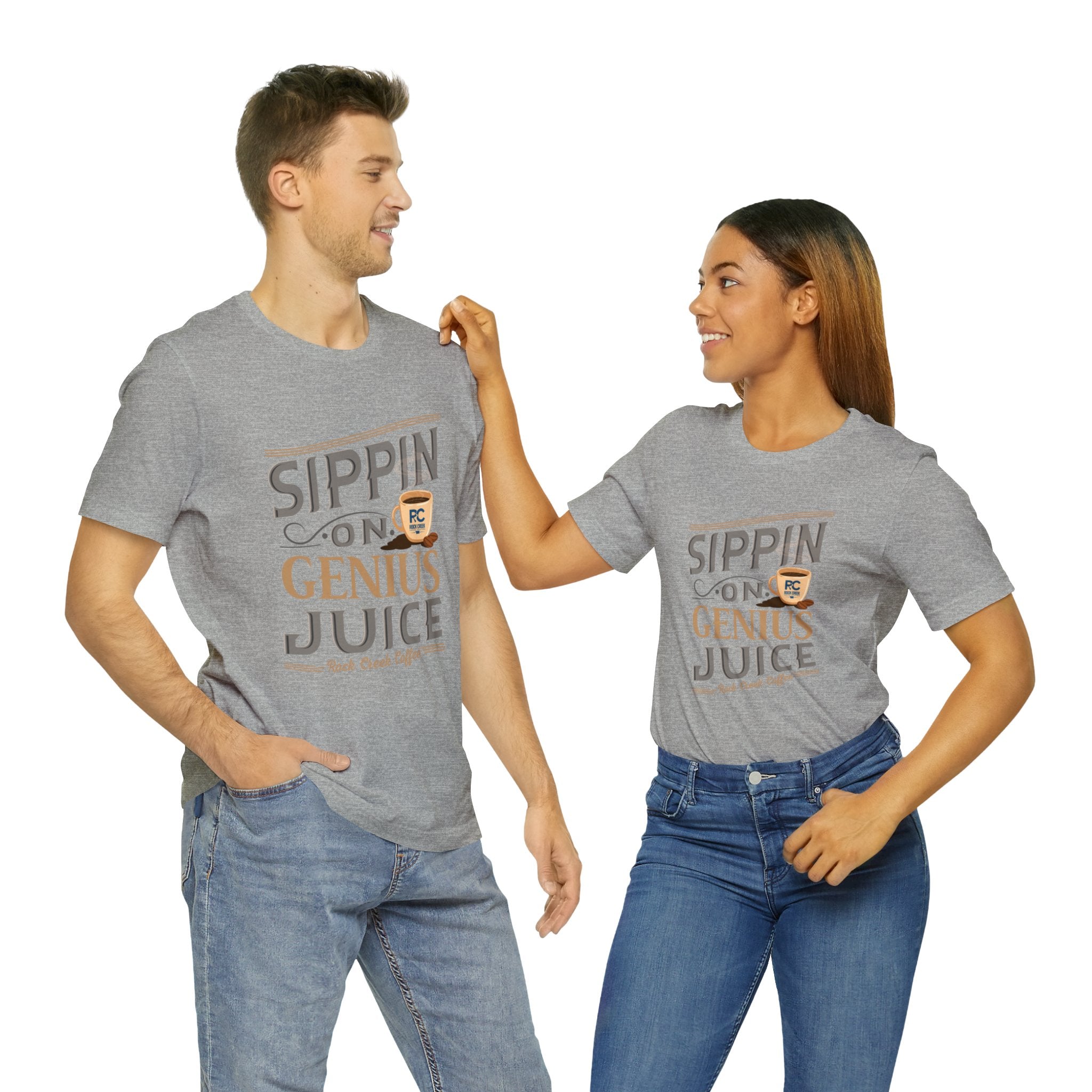 Adult man and woman modeling matching heather gray short-sleeve T-shirts featuring the “Sippin on Genius Juice” graphic in bold coffee-inspired lettering with a small cup illustration, shown against a plain white background.