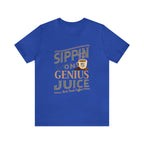 Royal blue short-sleeve T-shirt displayed flat against a plain white background, featuring the “Sippin on Genius Juice” graphic in bold coffee-inspired lettering with a small mug illustration.