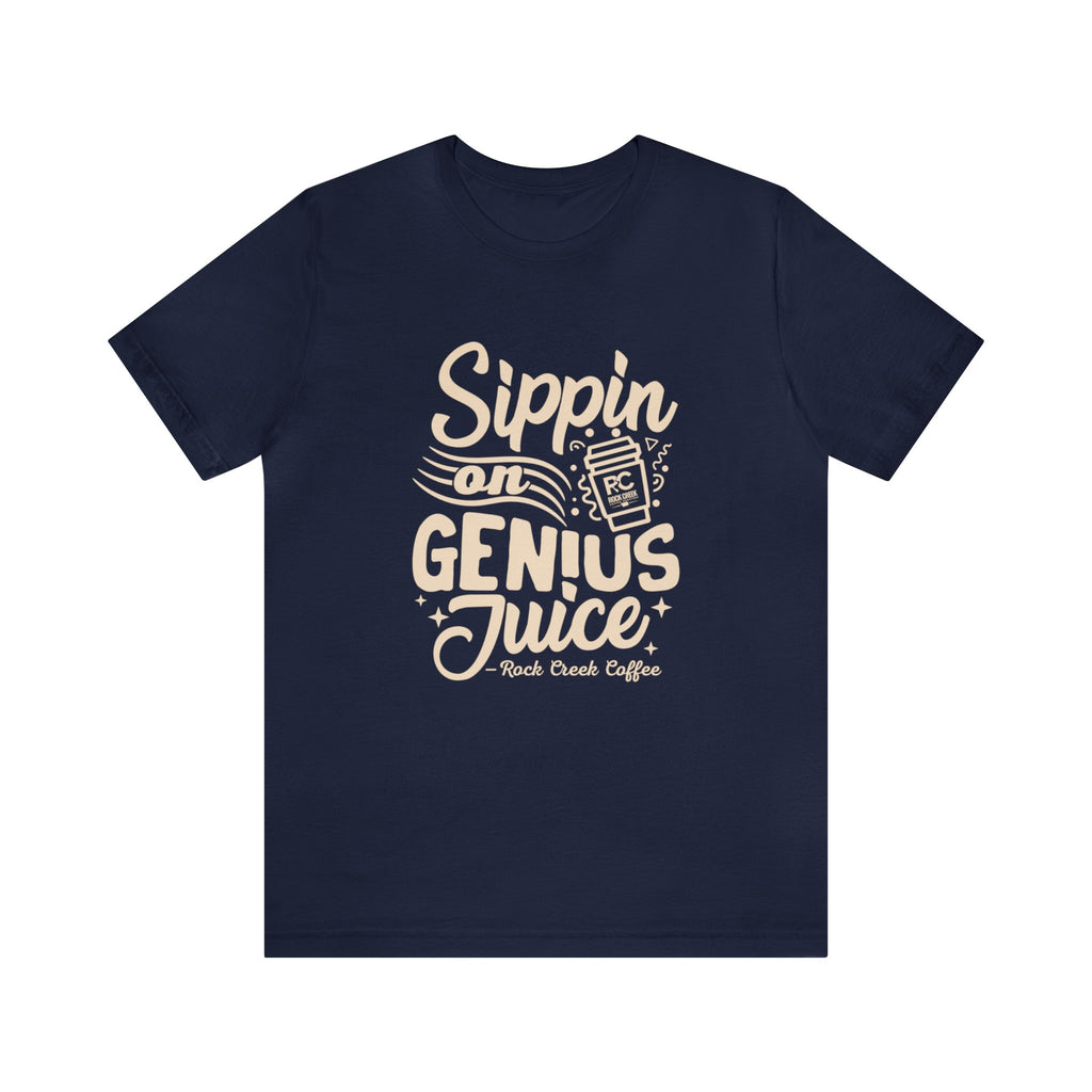 Navy blue short-sleeve T-shirt displayed flat against a white background featuring the “Sippin on Genius Juice” coffee-themed graphic with stylized lettering and a to-go cup illustration.