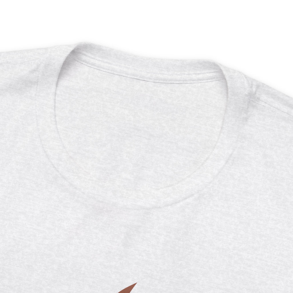 Close-up detail of an ash crew neck T-shirt showing the neckline, collar stitching, and upper chest area, with a small portion of the front graphic visible at the bottom edge against a plain white background.