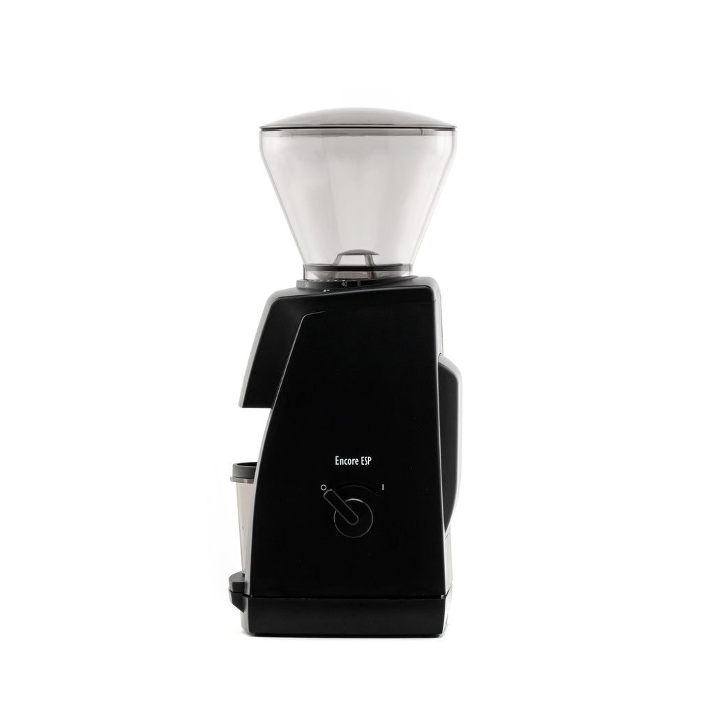 Side view of the black Baratza Encore ESP coffee grinder with a clear bean hopper and dosing cup, displayed against a white background.