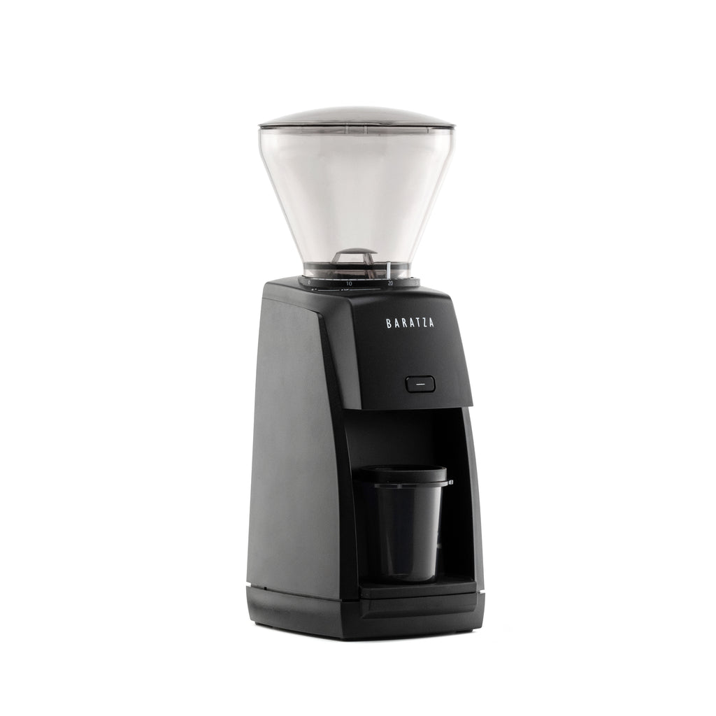 Three-quarter right view of the black Baratza Encore ESP coffee grinder with clear bean hopper and included dosing cup, displayed against a white background.