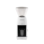 Front view of the white Baratza Encore ESP coffee grinder with clear bean hopper and included dosing cup, displayed against a white background.