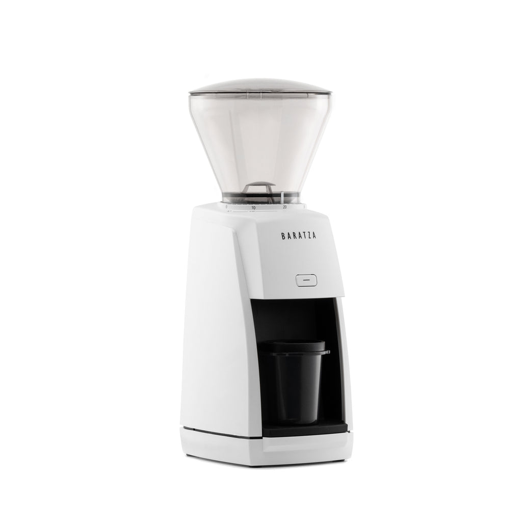 Three-quarter right view of the white Baratza Encore ESP coffee grinder with clear bean hopper and included dosing cup, displayed against a white background.