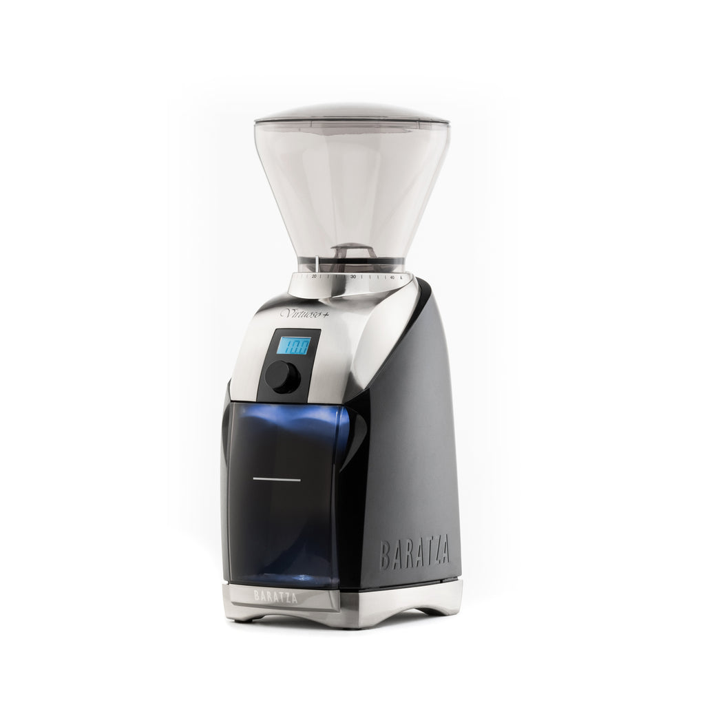 Three quarter front view of a Baratza Virtuoso Plus coffee grinder in black with stainless steel accents, clear bean hopper, digital timer display, and grounds bin, shown against a white background.