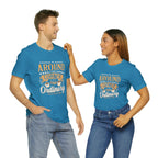 Adult man and woman modeling matching aqua short-sleeve T-shirts featuring the “Around the Corner from Ordinary” graphic in a bold coffee-themed typographic design, posed together against a plain white background.