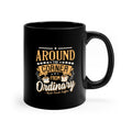 Black ceramic coffee mug with a glossy finish featuring the phrase “Around the Corner from Ordinary – Rock Creek Coffee” in gold and white lettering, accented with small coffee cup illustrations and decorative stars.