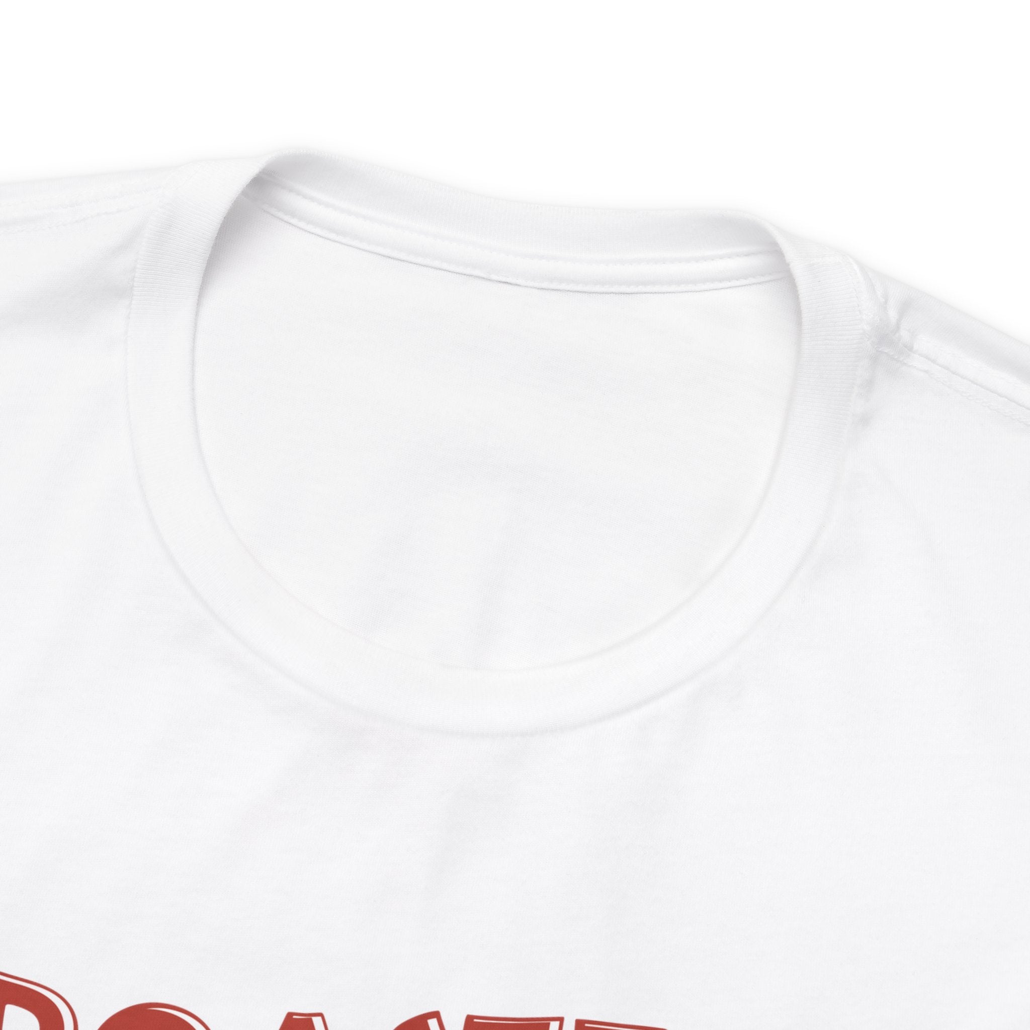 Detailed view showing the crew neckline and shoulder area of a white short-sleeve T-shirt on a white background, with the top edge of a colorful printed graphic visible below the collar.