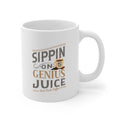 White Rock Creek Coffee mug featuring the phrase Sippin on Genius Juice in stylized gray and gold lettering with a small coffee cup graphic, shown on a clean white background.
