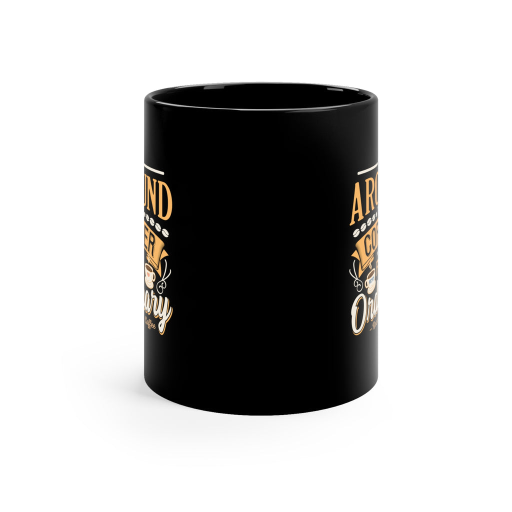 Back view of a black ceramic coffee mug with a glossy finish, showing partial side graphics of the Around the Corner from Ordinary Rock Creek Coffee design visible along the edges.