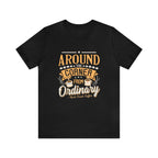 Black short-sleeve T-shirt displayed flat against a plain white background, featuring the phrase “Around the Corner from Ordinary” in a bold coffee-themed typographic design with Rock Creek Coffee branding below.