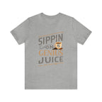 Heather gray short-sleeve T-shirt displayed flat against a plain white background, featuring the “Sippin on Genius Juice” graphic in large coffee-inspired lettering with a small mug illustration.