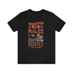 Black Seattle coffee graphic T-shirt with “Roasted 818 Miles East of Seattle” design, shown against a plain white background.