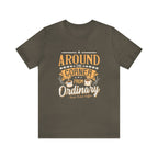 Army green short-sleeve T-shirt displayed flat against a plain white background, featuring the phrase “Around the Corner from Ordinary” in a bold coffee-themed typographic design with Rock Creek Coffee branding below.
