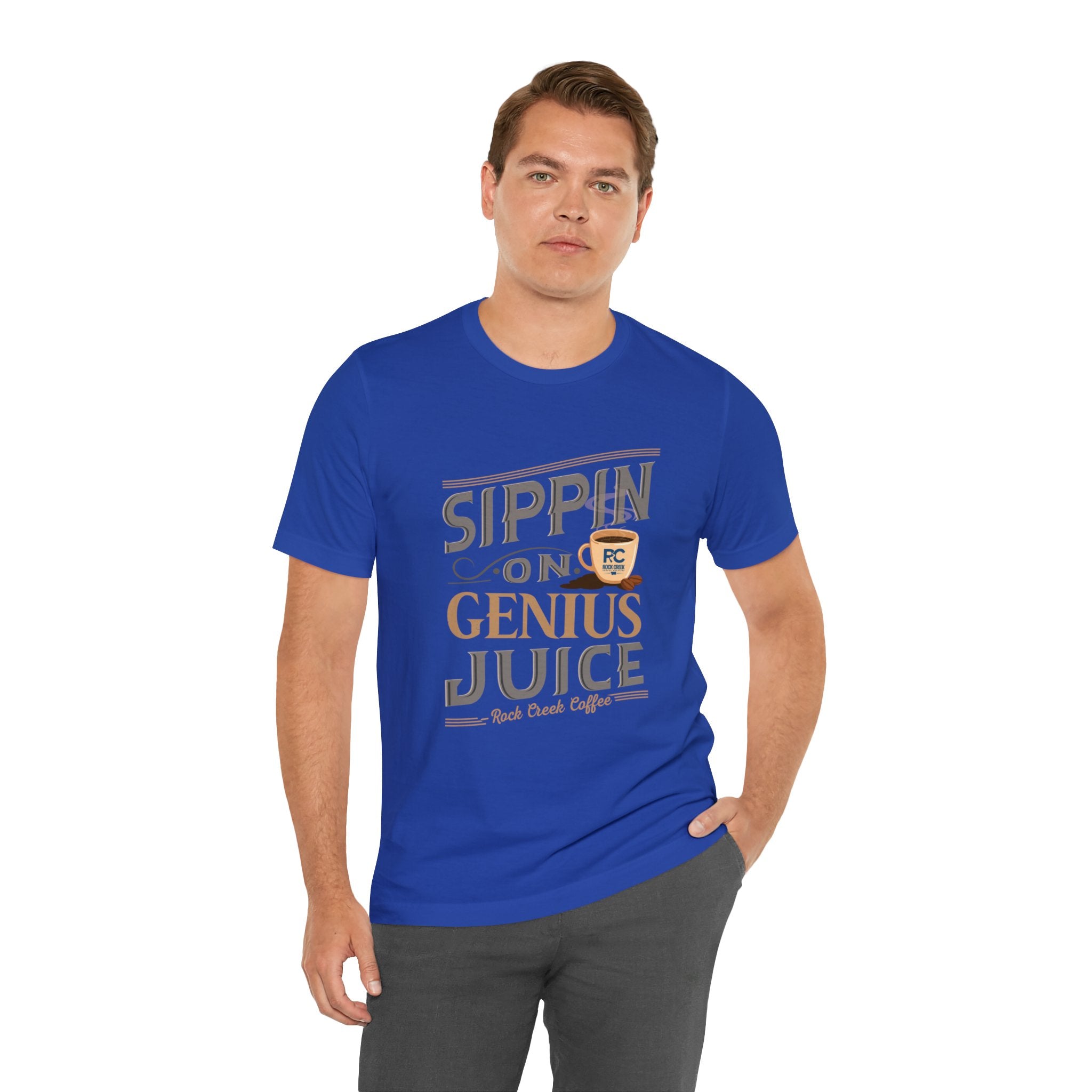 Adult man modeling a royal blue short-sleeve T-shirt printed with the “Sippin on Genius Juice” graphic in bold coffee-inspired lettering with a small mug illustration, shown against a plain white background.