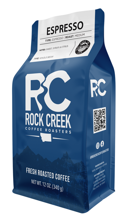 Rock Creek Coffee Roasters Espresso whole bean coffee in a blue 12 ounce bag featuring medium roast details and tasting notes of sweet syrup and citrus