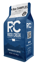 Rock Creek Coffee Roasters 4 eight ounce sample pack in a blue bag featuring whole bean options from multiple origins and roast levels