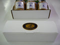 White gift box with caramel cookie waffles arranged in packaging on a white surface