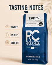 Load image into Gallery viewer, Rock Creek Coffee Roasters Espresso coffee bag shown with tasting notes for sweet, syrup, and citrus on a clean warm graphic layout.