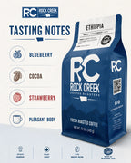 Rock Creek Coffee Roasters Ethiopia coffee bag with tasting notes for blueberry, cocoa, strawberry, and pleasant body.