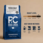 Rock Creek Coffee Roasters French Roast whole bean coffee bag with a dark roast level guide and best brew method icons.