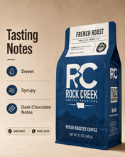 Load image into Gallery viewer, Rock Creek Coffee Roasters French Roast coffee bag on a warm beige background with a “Tasting Notes” graphic highlighting sweet, syrupy, and dark chocolate notes, plus dark roast and whole bean details.
