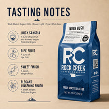 Load image into Gallery viewer, Tasting notes graphic for Rock Creek Coffee Roasters Wush Wush coffee, featuring the blue coffee bag with notes for juicy sangria, ripe fruit, sweet finish, and elegant lingering finish.