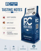 Tasting notes graphic for Rock Creek Coffee Roasters Wush Wush coffee, featuring the blue coffee bag with notes for juicy sangria, ripe fruit, sweet finish, and elegant lingering finish.